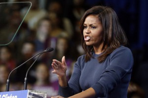 First lady Michelle Obama speaks during a campaign rally for Democratic presidential candidate Hillary Clinton Thursday, Oct. 13, 2016, in Manchester, N.H. (AP Photo/Jim Cole)