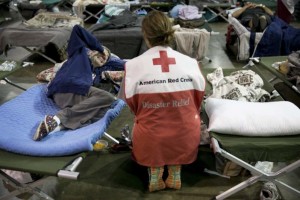 Volunteer Lisa Black comforts Janice Forse at the emergency shelter at the Beaumont Civic Center in Beaumont,Texas, after Hurricane Harvey on Wednesday, Aug. 30, 2017. Her home in Beaumont was flooded Wednesday morning. "Even Katrina wasn't this bad," she said. (Jay Janner/Austin American-Statesman via AP)